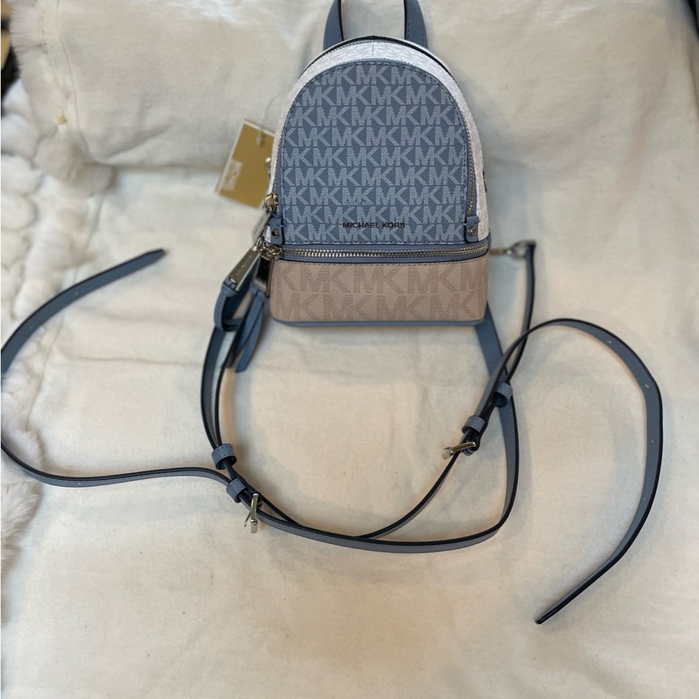 Michael Kors Rhea zip extra small messenger backpack